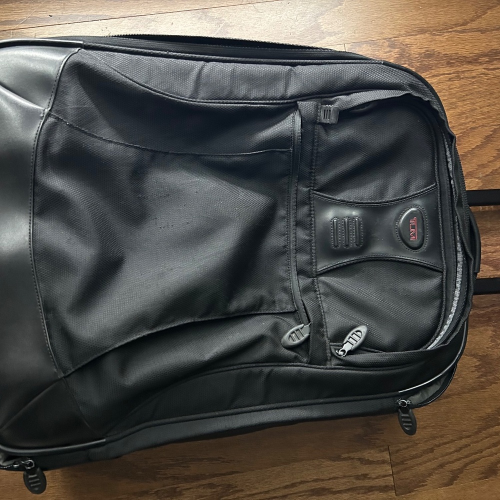 Black Tumi carry on suitcase